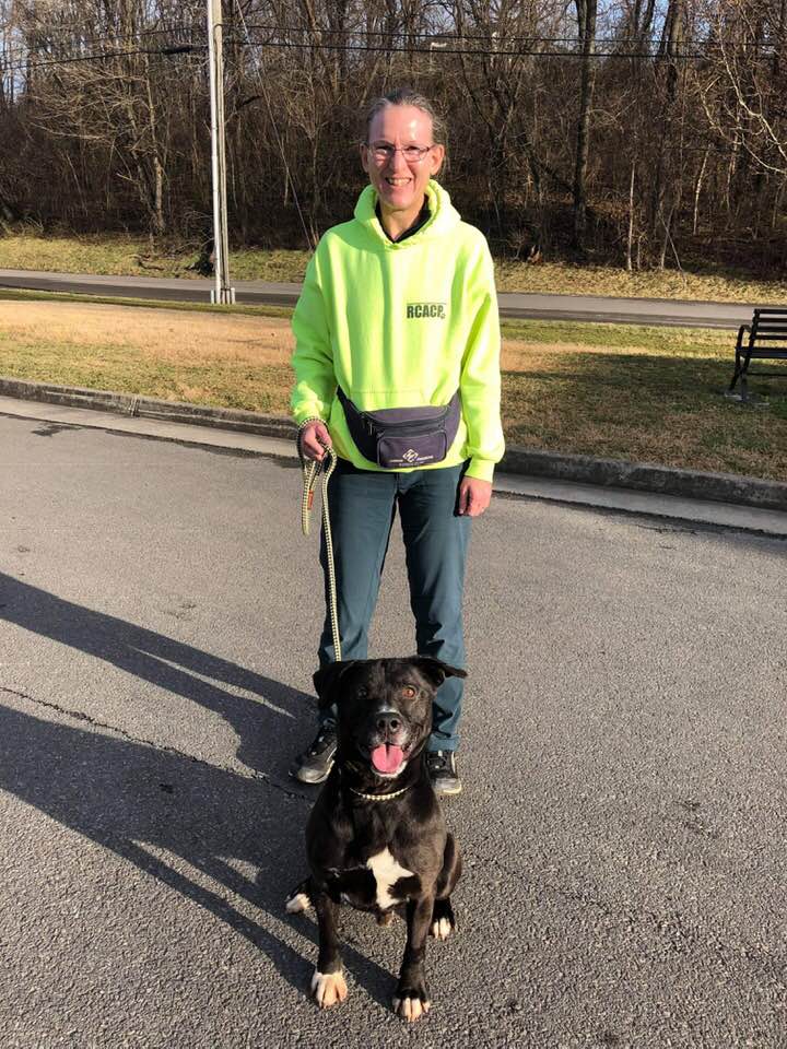 RCACP Volunteer Posing with a Dog.